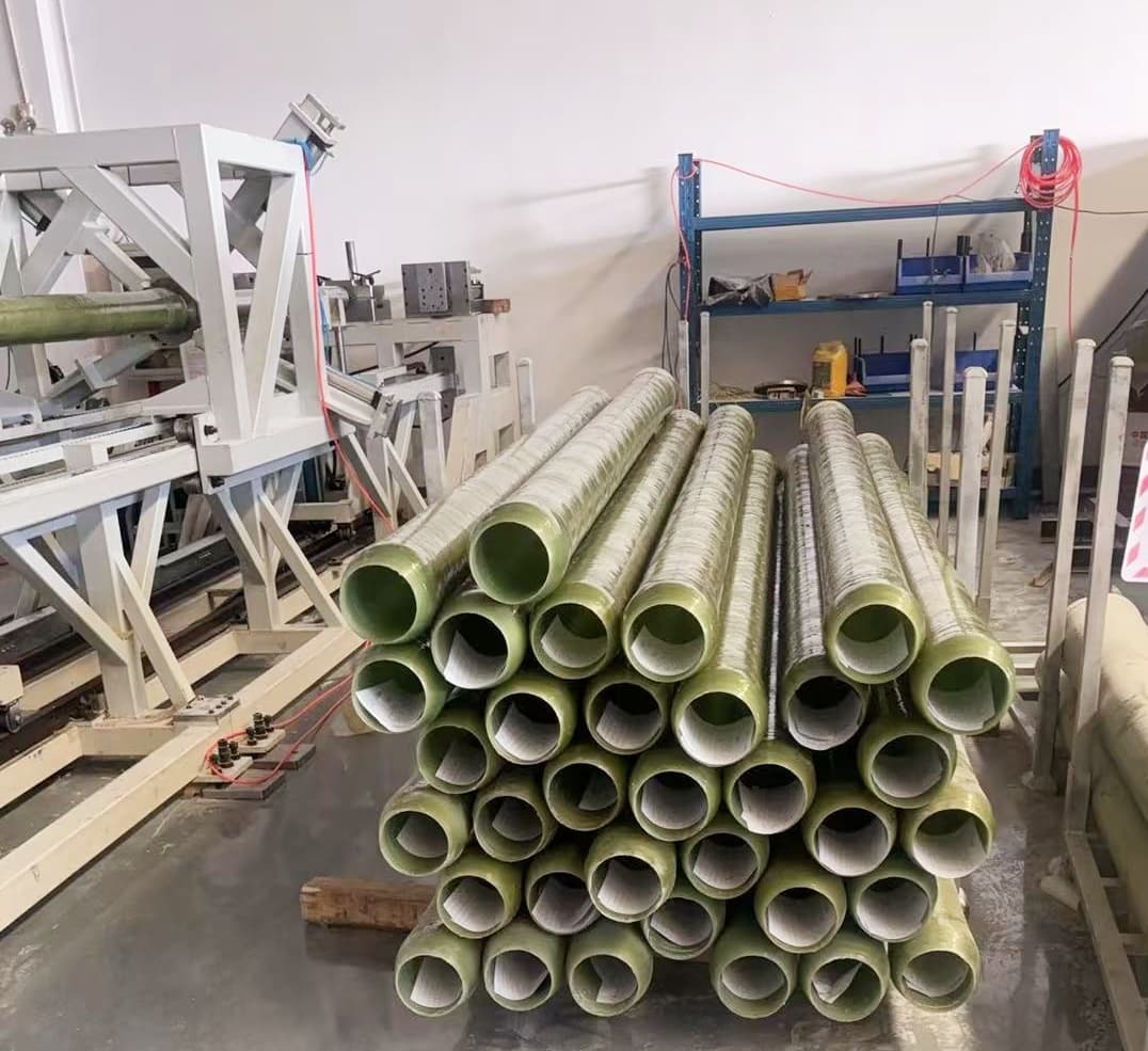 Epoxy fiberglass filament wound tubes stacked in a production environment