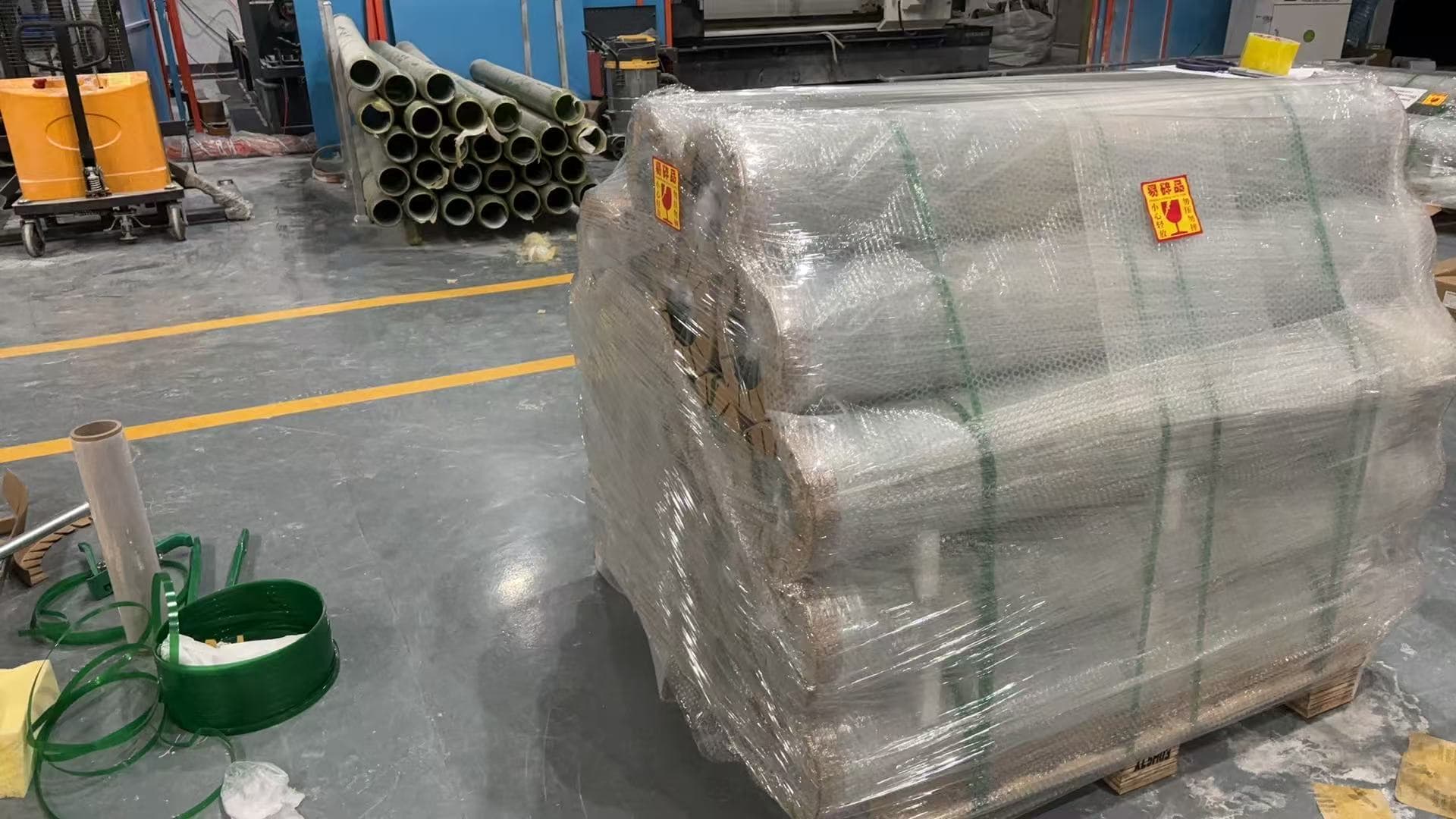 Wrapped and labeled epoxy fiberglass tubes prepared for shipment